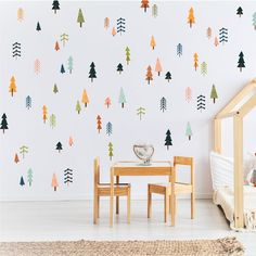 a child's room with trees on the wall