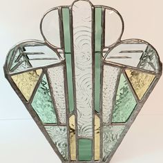 an art deco stained glass vase on display