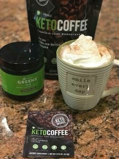 a cup of coffee next to a bag of keto coffee on a counter top