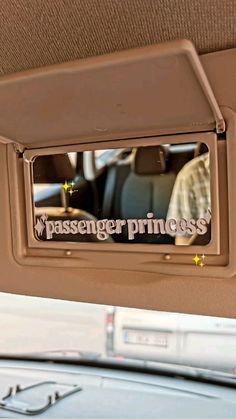 the passenger princess sign is hanging on the car door