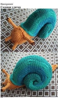 two knitted snails sitting on top of each other, one blue and the other green