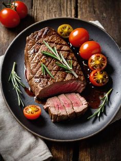 steak with cherry tomatoes and rosemary garnish on a plate