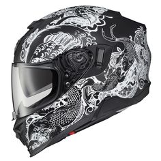 a motorcycle helmet with dragon designs on it