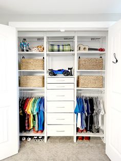 a white closet filled with lots of clothes and baskets on top of it's shelves