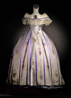 Evening dress, French, circa 1860. Silk brocade with applications of tulle and silk ribbon. Via soytotalmentepalacio.com.mx. Old Dresses