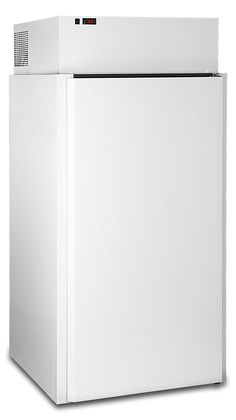 a white refrigerator freezer sitting on top of a white floor next to a wall