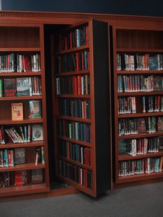 two wooden bookshelves filled with lots of books