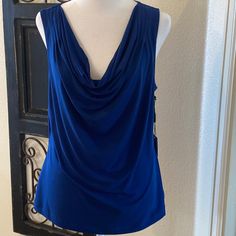 Calvin Klein Size Large Royal Blue Sleeveless Top With A Draped Neck Front. New With Tags And Pairs With Skirt And Jacket. Elegant Blue Summer Vest, Blue Stretch Sleeveless Vest, Blue Stretch Tank Vest, Chic Blue Tank Vest, Blue Tank Tops For Night Out, Elegant Blue Camisole Tank Top, Chic Blue Camisole Tank Top, Blue Sleeveless Blouse For Night Out, Blue Camisole Tank Top For Night Out