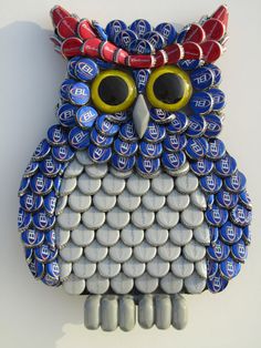 an owl made out of beer bottle caps