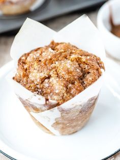 a muffin sitting on top of a white plate