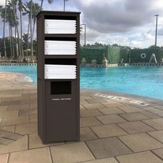 there is a mailbox next to the swimming pool