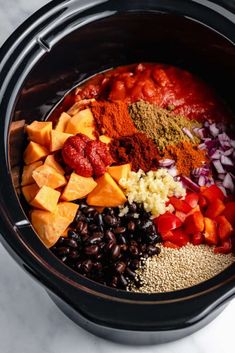 an image of food in the slow cooker to make tacos and burritos