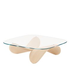 an oval glass and wood coffee table with two curved wooden legs on the bottom, in front of a white background