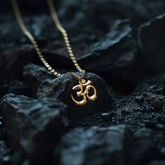 Connect with the sacred sound of the universe with our gold Om pendant, finely crafted in the USA. Representing the essence of ultimate reality, consciousness, and inner peace, each piece is a harmonious blend of spirituality and artistry. PENDANT INFORMATIONThis pendant is made of real, solid gold.• Made in USA• Material: 14k or 18k solid gold• Finish: polished• Height: 1" (27 mm) x Width: 1" (26 mm)• Pendant weight: approx. 6 grams (14k)• Bail: fits up to 4 mm chains• Solid back, not hollow• A Om Gold Pendant For Men, Om Pendant For Men, Shivratri Photo, Matte Black Accessories, Gold Pendants For Men, Decor Paintings, Om Pendant, Gold Bangles For Women, Skull Rings