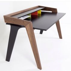 a wooden table with three different colored sections on it