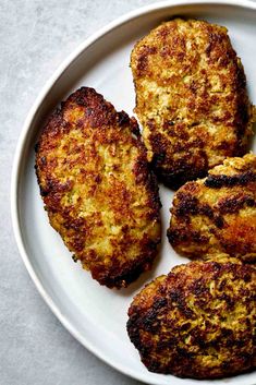 three pieces of food on a plate with text overlay that reads, how to make italian kolet meat and potato patties