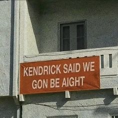 a sign on the side of a building that says, kentucky said we go be alright