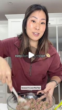 a woman is preparing food in a bowl on the kitchen counter and she is using a spoon to stir it