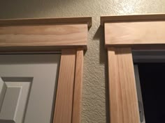 two wooden window frames are shown against the wall