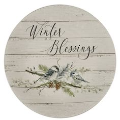 a white plate with two birds on it and the words winter blessing written in black