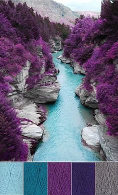 purple and blue hues in the water next to some rocks with trees on them