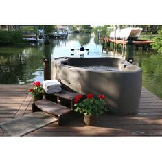 a hot tub sitting on top of a wooden dock