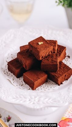 a white plate topped with brownies on top of a table