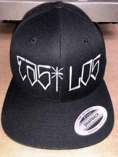 Brand New East Los Cap. yupoong cap snapback black . Nice cap with embroidered design. Black Flat Bill Baseball Cap Tagless, Fitted Black Snapback Hat With Flat Brim, Fitted Black Snapback Hat, Streetwear Trucker Hat With Custom Logo And Flat Bill, Streetwear Trucker Hat With Custom Logo, Black Snapback Hat With Custom Logo, Adjustable Hats With Custom Logo For Streetwear, Black Letter Print Trucker Hat Flat Cap, Fitted Snapback Cap For Streetwear