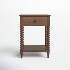 a small wooden table with two drawers