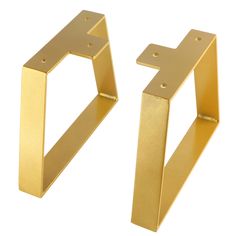 two gold metal brackets on a white background