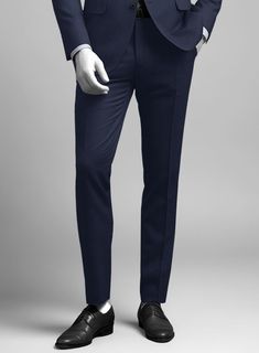 The royal blue pants exude refinement with a rustic edge owing to the birdseye weave finish. This finish fuses a smart tailored cut with a subtle interest design. Crafted from wool with just the right amount of micro rayon, this suit is stylishly designed from the finest 140-count superfine wool fabric.   Look Includes    Napolean Royal Blue Birdseye Wool  Fabric  Cross Pocket  Flat Front  Two Welted Back Pockets on Trousers   Click 'Customize Now' to modify the look if needed.  Lining: Viscose, Dry Clean, Pants can be lightly washed. Formal Blue Wool Bottoms, Blue Wool Bottoms With Welt Pockets, Tailored Wool Blue Bottoms, Tailored Blue Wool Bottoms, Fitted Wool Blue Dress Pants, Fitted Wool Blue Bottoms, Fitted Blue Wool Dress Pants, Blue Wool Dress Pants For Work, Fitted Blue Wool Bottoms