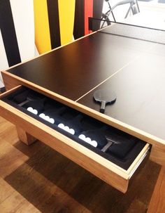 a ping pong table with four paddles in it