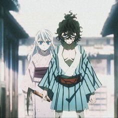 two anime characters standing next to each other