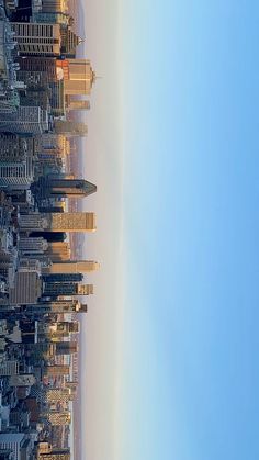 an aerial view of the city skyline with tall buildings