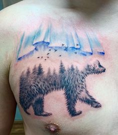 a man with a bear tattoo on his chest