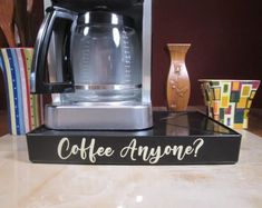 a coffee maker sitting on top of a counter