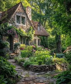 a stone house surrounded by trees and flowers