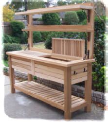 a wooden bench sitting in the middle of a garden