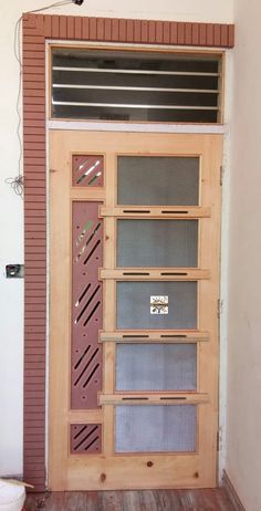 a wooden door with metal bars on it