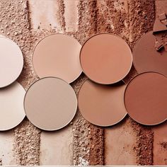 several different shades of powder makeup on a brick wall with the words, what's your favorite shade?