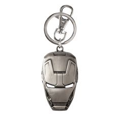 an iron man mask keychain is shown on a white background and it has a metal