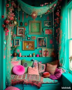 a room filled with lots of colorful pillows and pictures