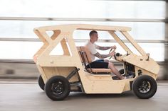 a man driving an electric vehicle on the street