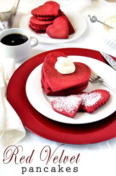 red velvet pancakes with powdered sugar in the shape of hearts