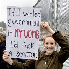 a woman holding up a sign that says if i wanted government in my wob