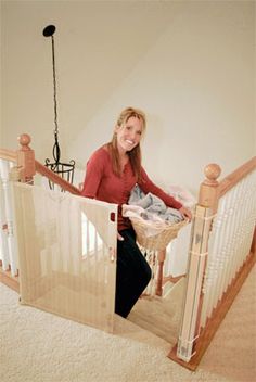 a woman standing at the top of a stair case