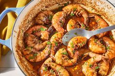 a pan filled with cooked shrimp and sauce