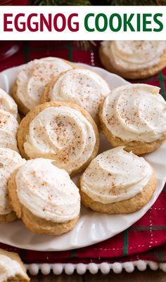 a plate filled with frosted cookies on top of a table