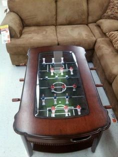 a coffee table with a foosball game on it