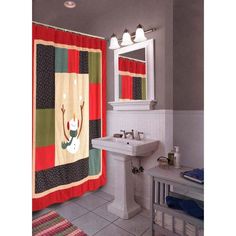 a bathroom with a sink, mirror and shower curtain that has a reindeer on it